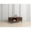 Coffee table in a modernly decorated living room. It shows the cupboard, internal shelf and top surface area in use.