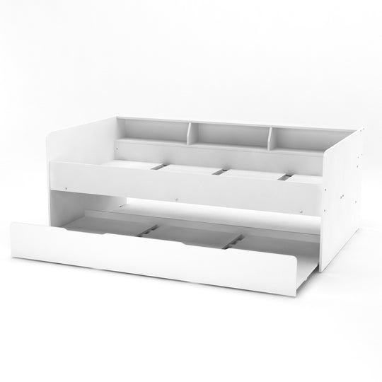Side view of the white daybed. It shows the included pull-out guest bed and built-in bookcase.