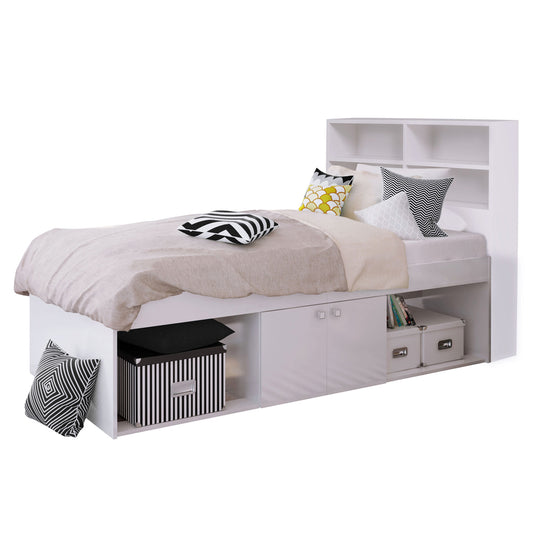 A white bed frame with a built-in 2 door central cupboard underneath, with an open recess on each side. A 4 cube bookcase headboard is also attached.