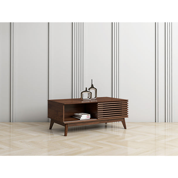 Coffee table in a modernly decorated living room. It shows the cupboard, internal shelf and top surface area in use.