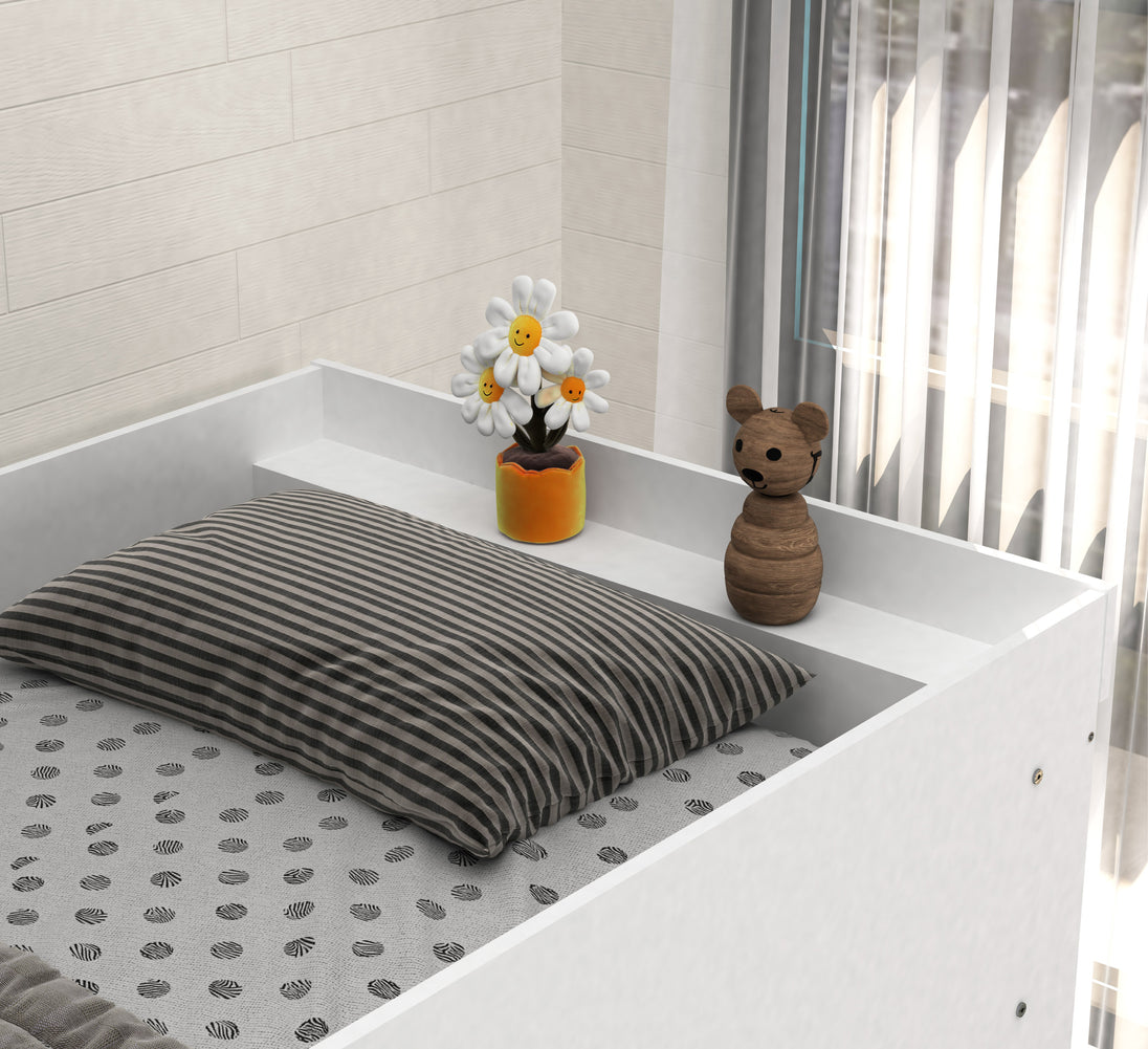 striped pillow, flower, and teddy bear in a room with white walls and a window.